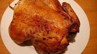 Курица в фольге на углях целиком