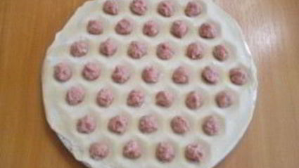 пельмени под соусом